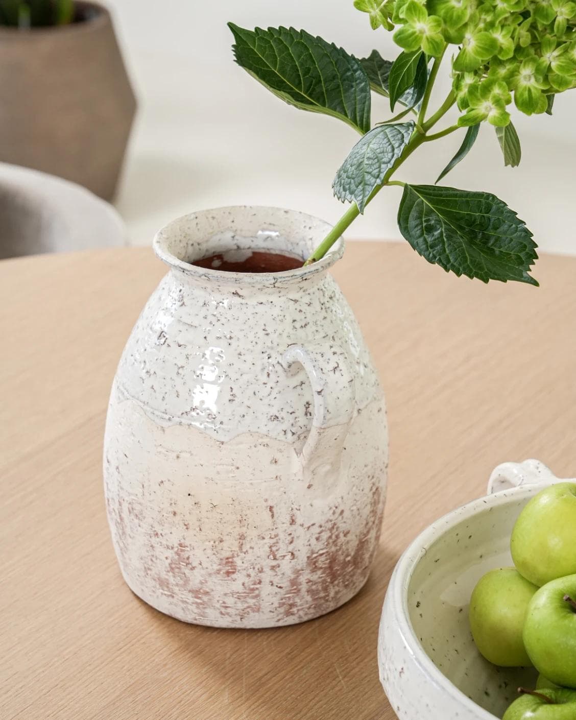 Becca Terra vases in soft stone and white, shown in a lifestyle top view as image 6