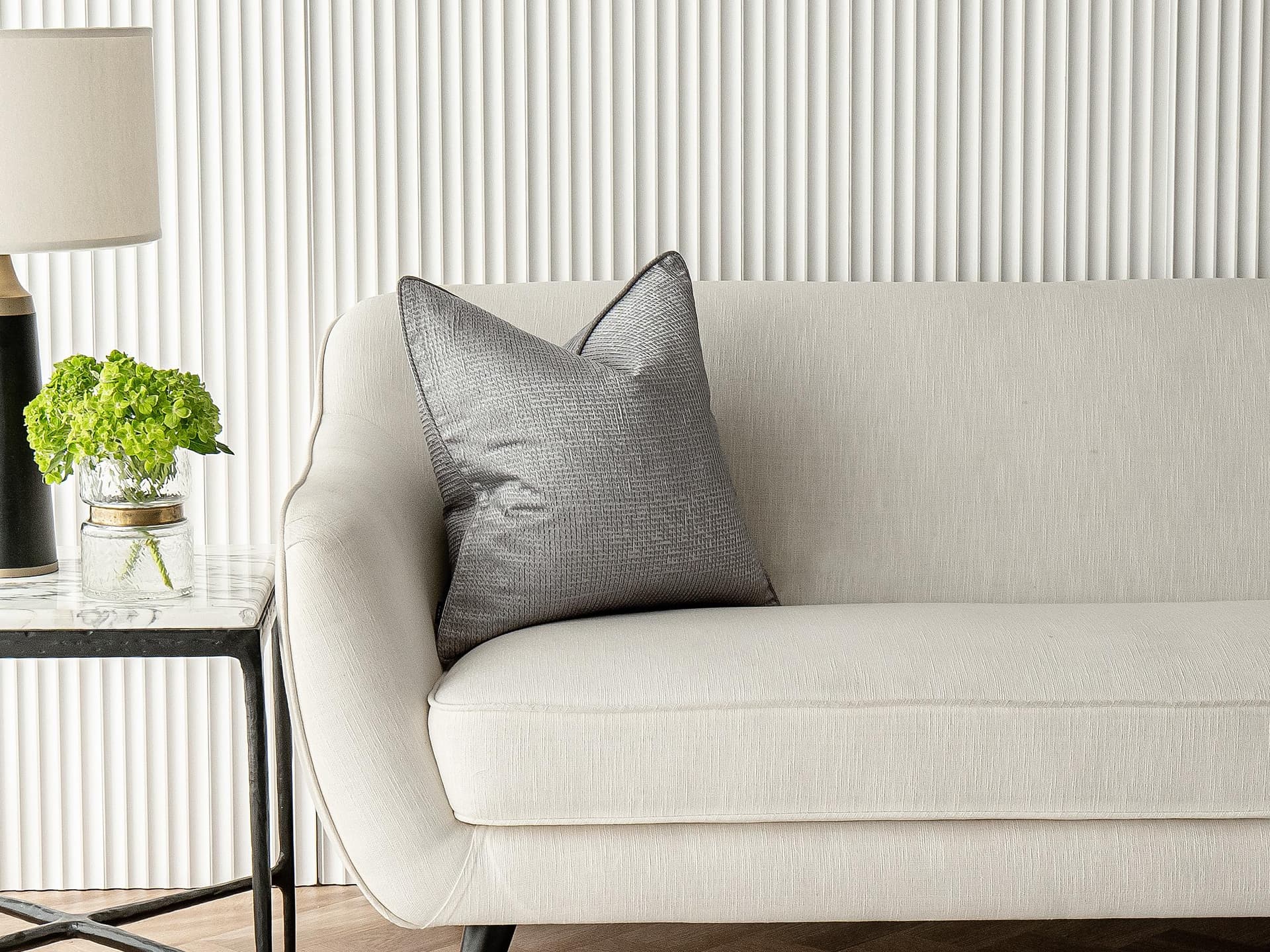 Benjamin Laurent cushion in silver and black, shown in a lifestyle front view as image 1