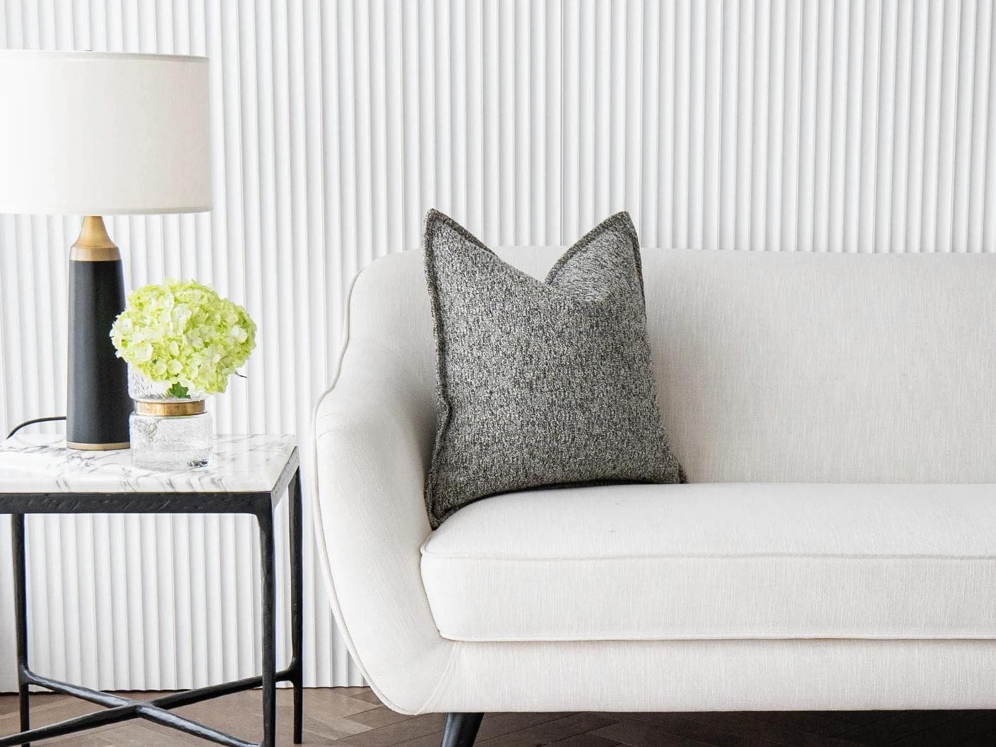 Bennett Steele cushion in silver and grey, shown in a lifestyle front view as image 4