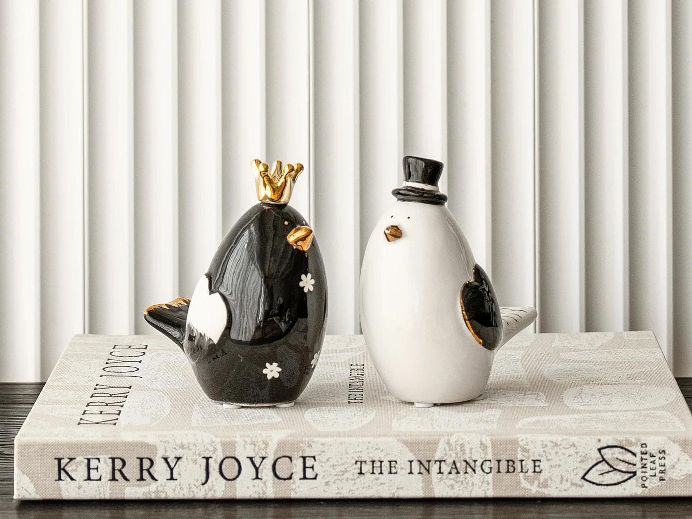 Berdy Arneson statues and sculptures in gold, white and black, shown in a lifestyle front view as image 1