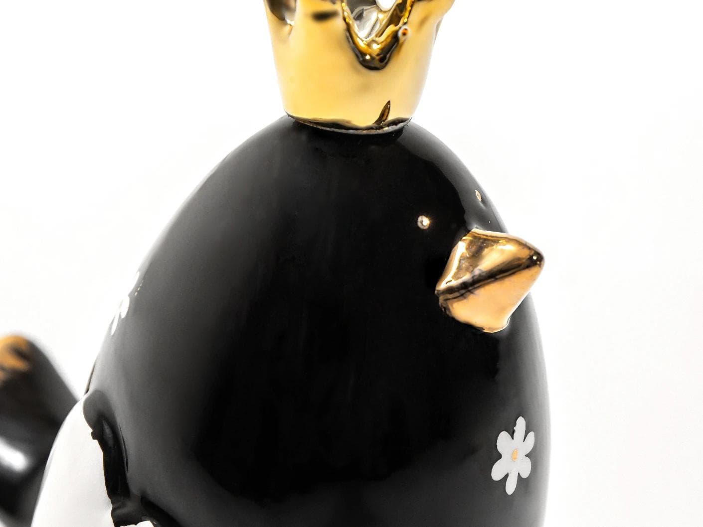 Berdy Arneson statues and sculptures in gold, white and black, shown in a product close-up back view as image 2