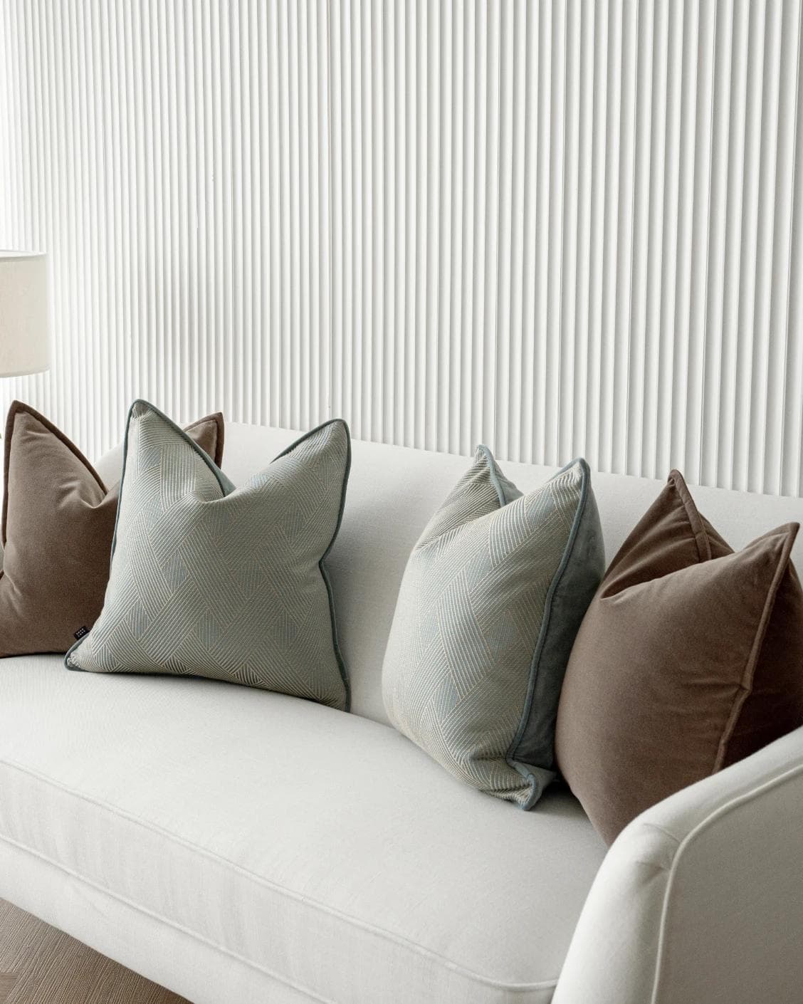 Bernie Bundle cushion in brown and blue, shown in a lifestyle right view as image 5