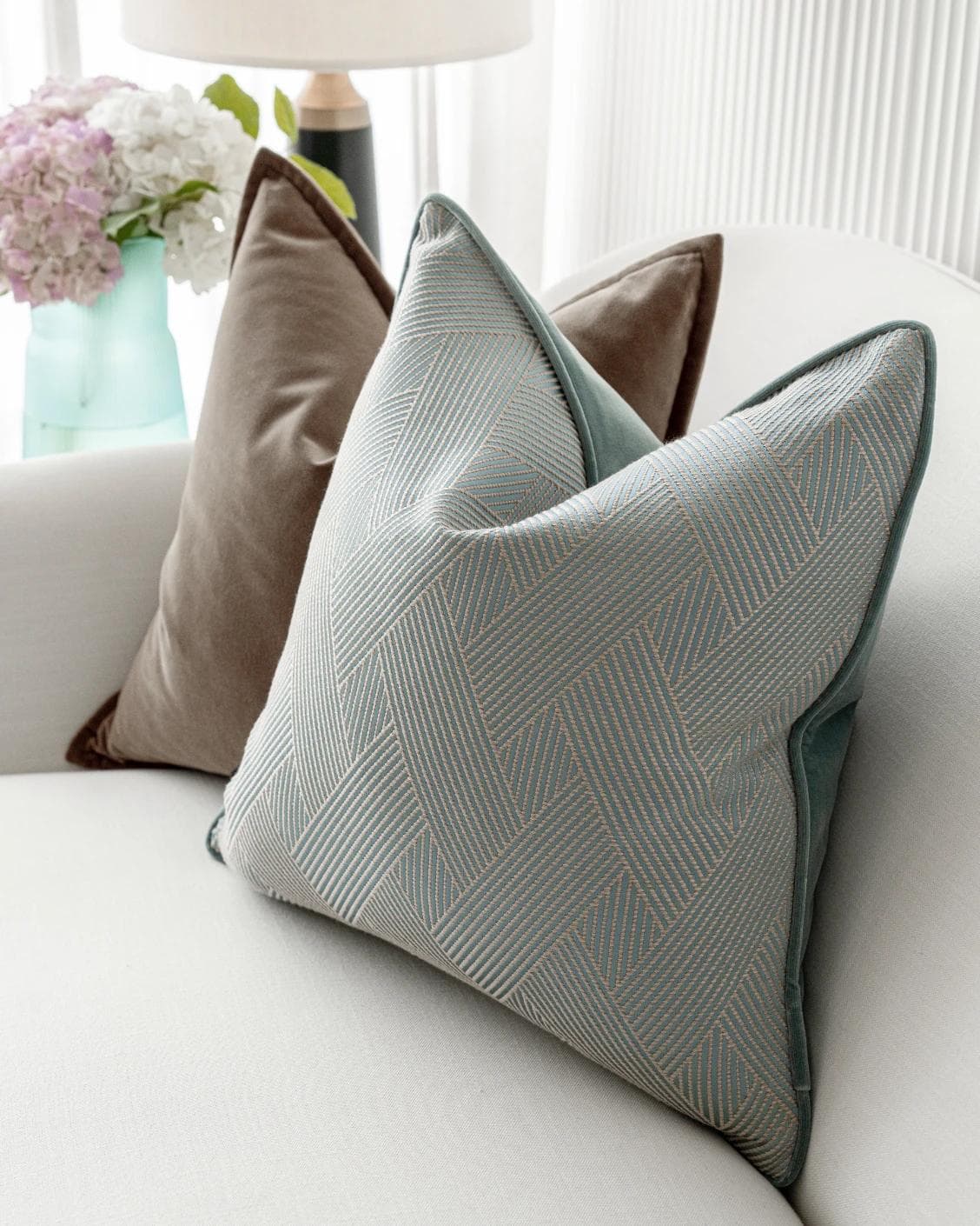 Bernie Bundle cushion in brown and blue, shown in a lifestyle right view as image 6
