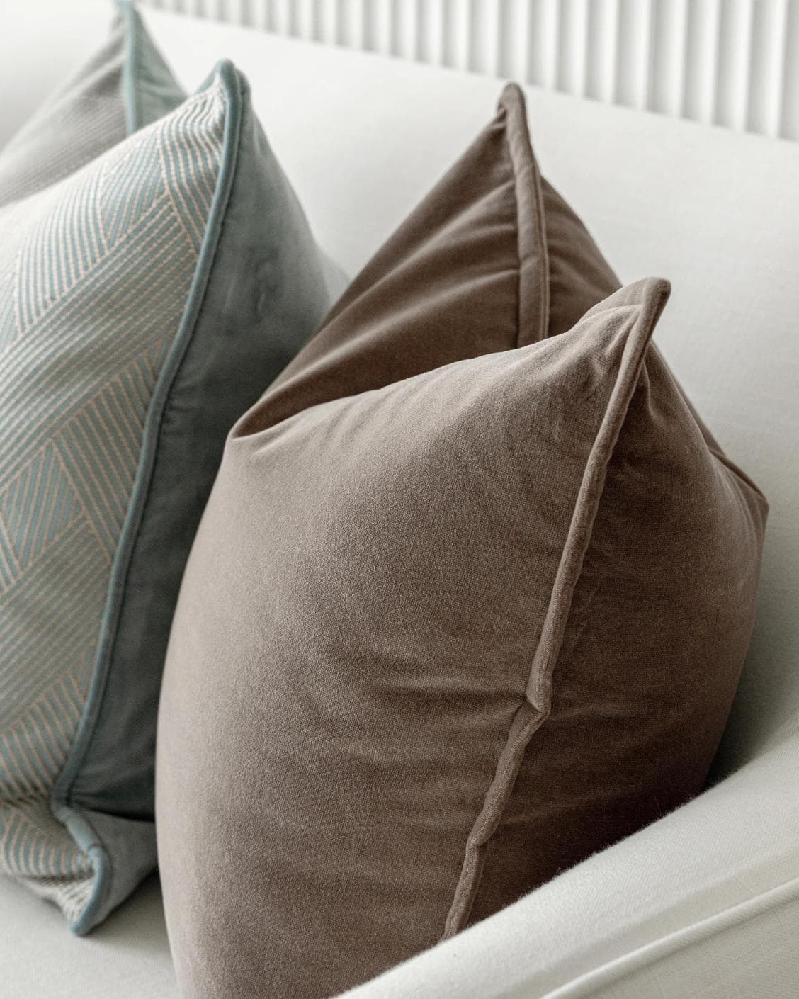 Bernie Bundle cushion in brown and blue, shown in a product right view as image 7