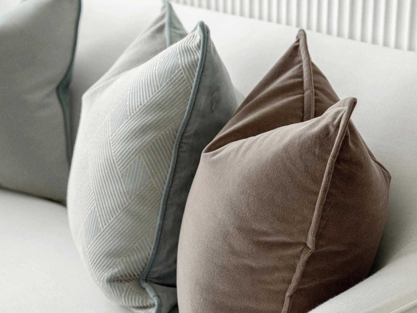 Bernie Bundle cushion in brown and blue, shown in a product right view as image 7