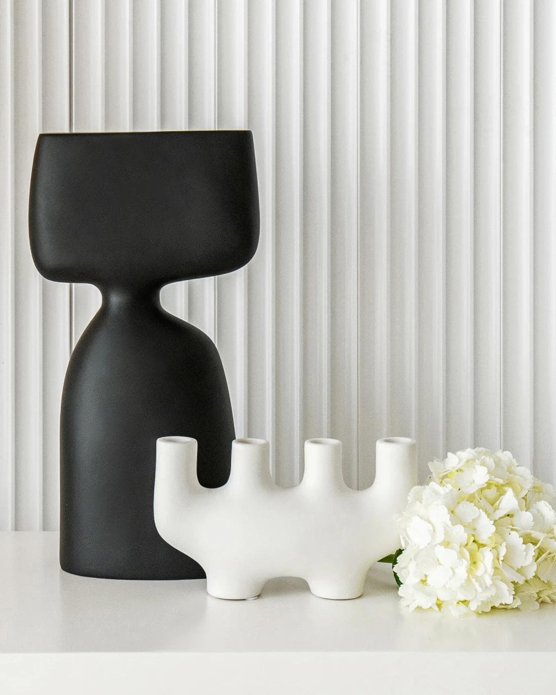 Berta Arneson vases in white and black, shown in a lifestyle front view as image 2