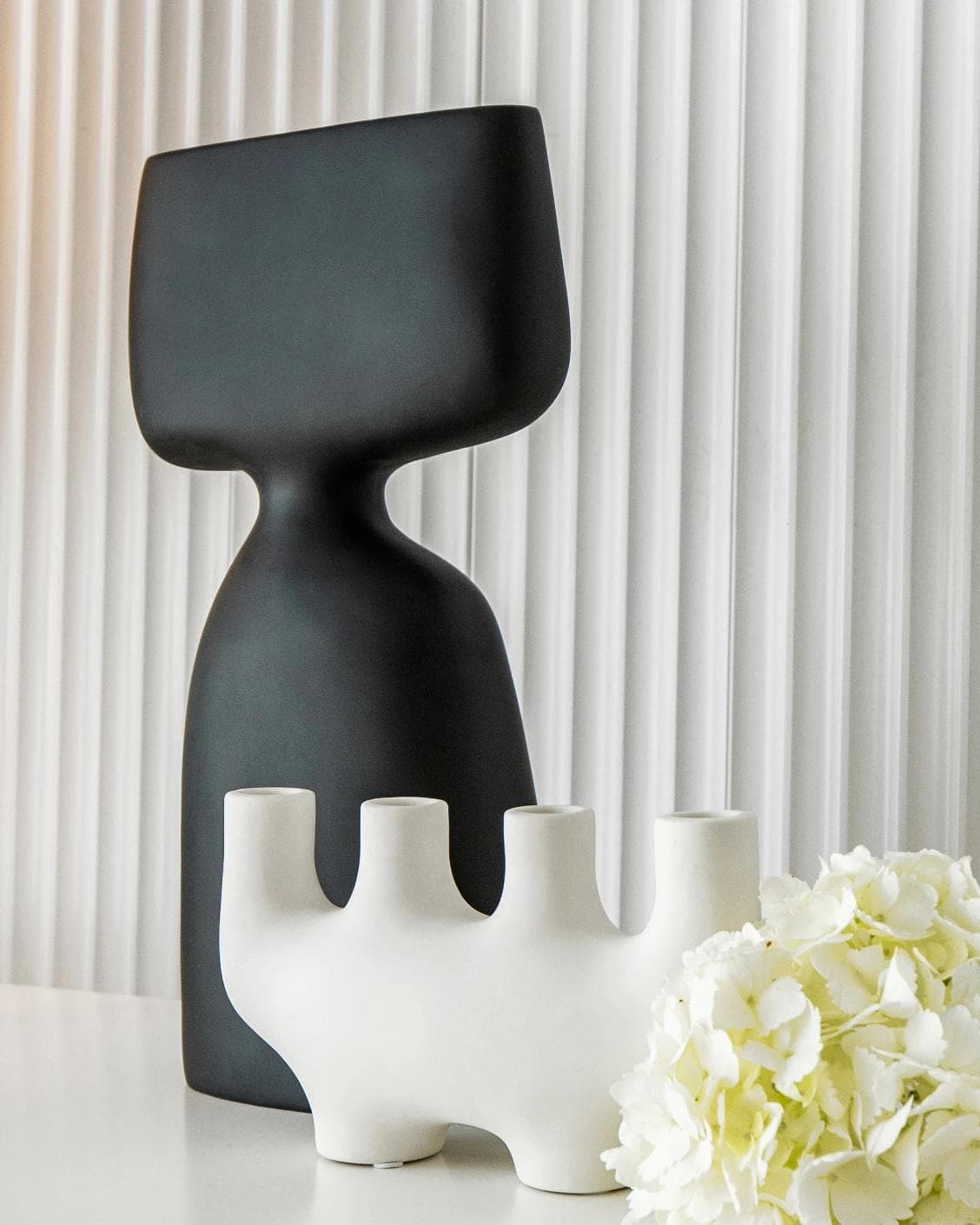 Berta Arneson vases in white and black, shown in a lifestyle right view as image 4
