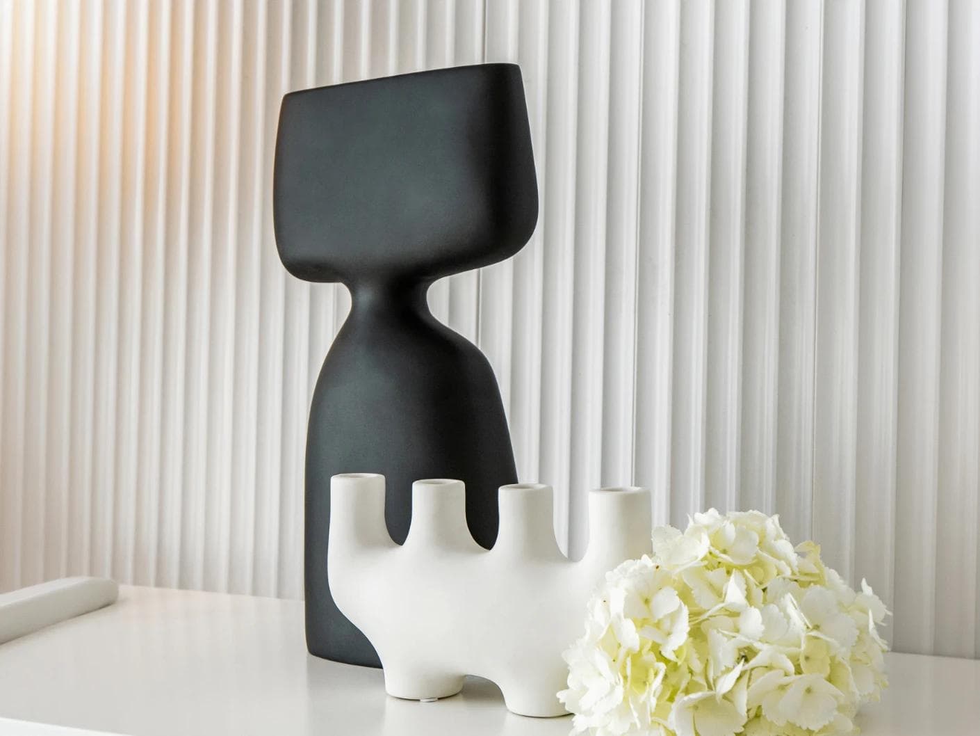 Berta Arneson vases in white and black, shown in a lifestyle right view as image 4
