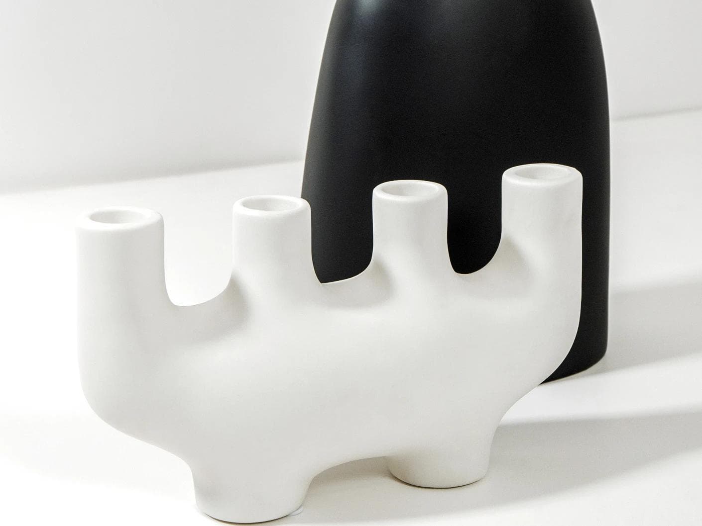 Berta Arneson vases in white and black, shown in a product left view as image 6