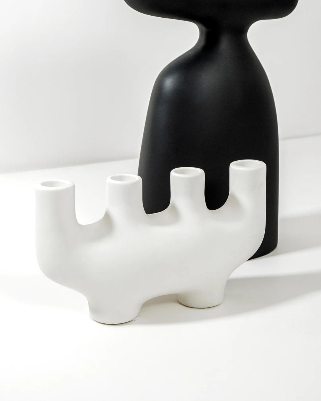 Berta Arneson vases in white and black, shown in a product left view as image 6