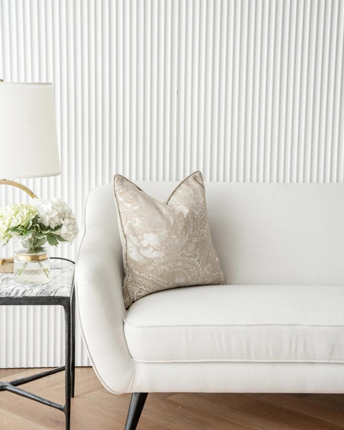 Berti Hodler cushion in beige and silver, shown in a lifestyle front view as image 4