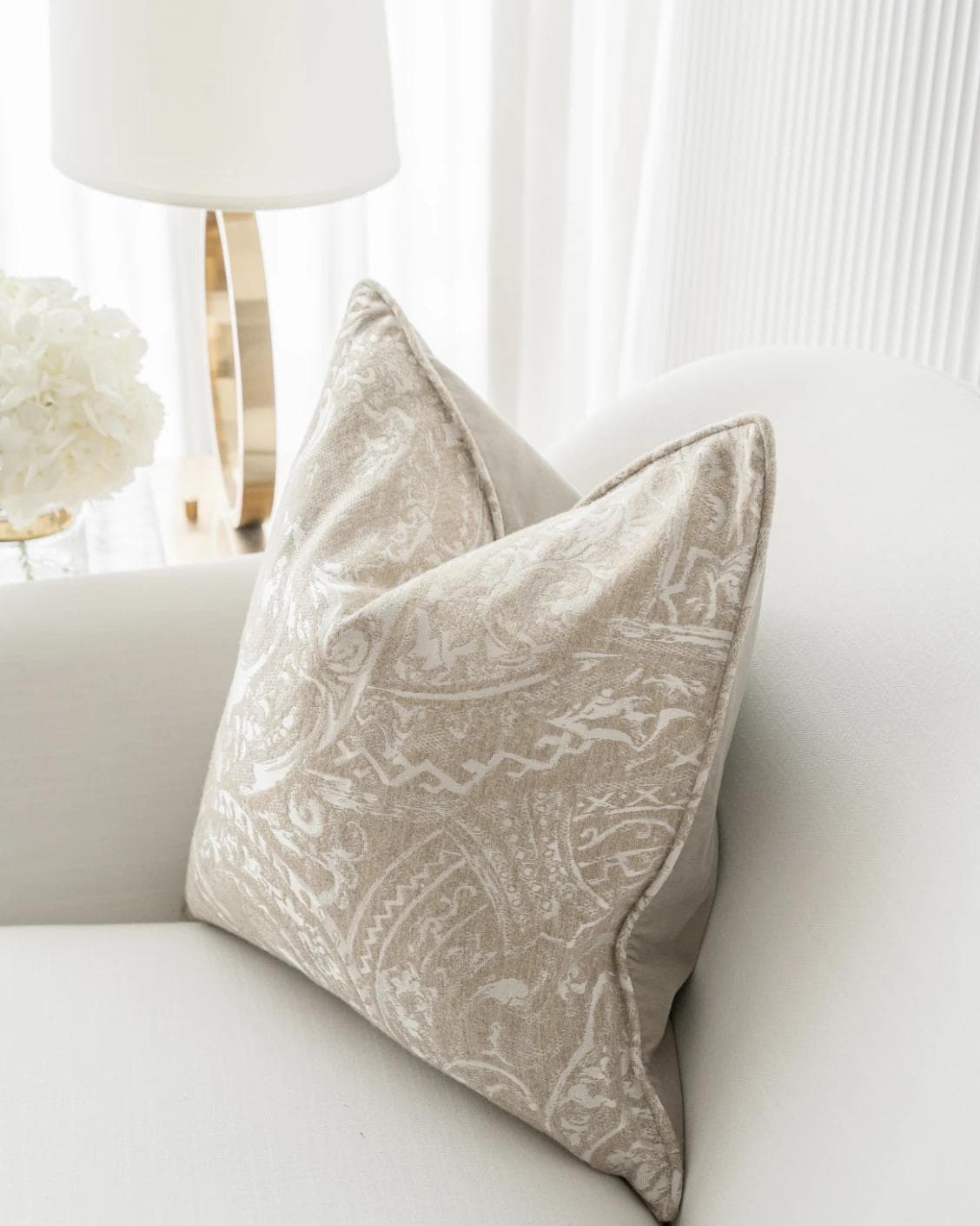 Berti Hodler cushion in beige and silver, shown in a lifestyle right view as image 6