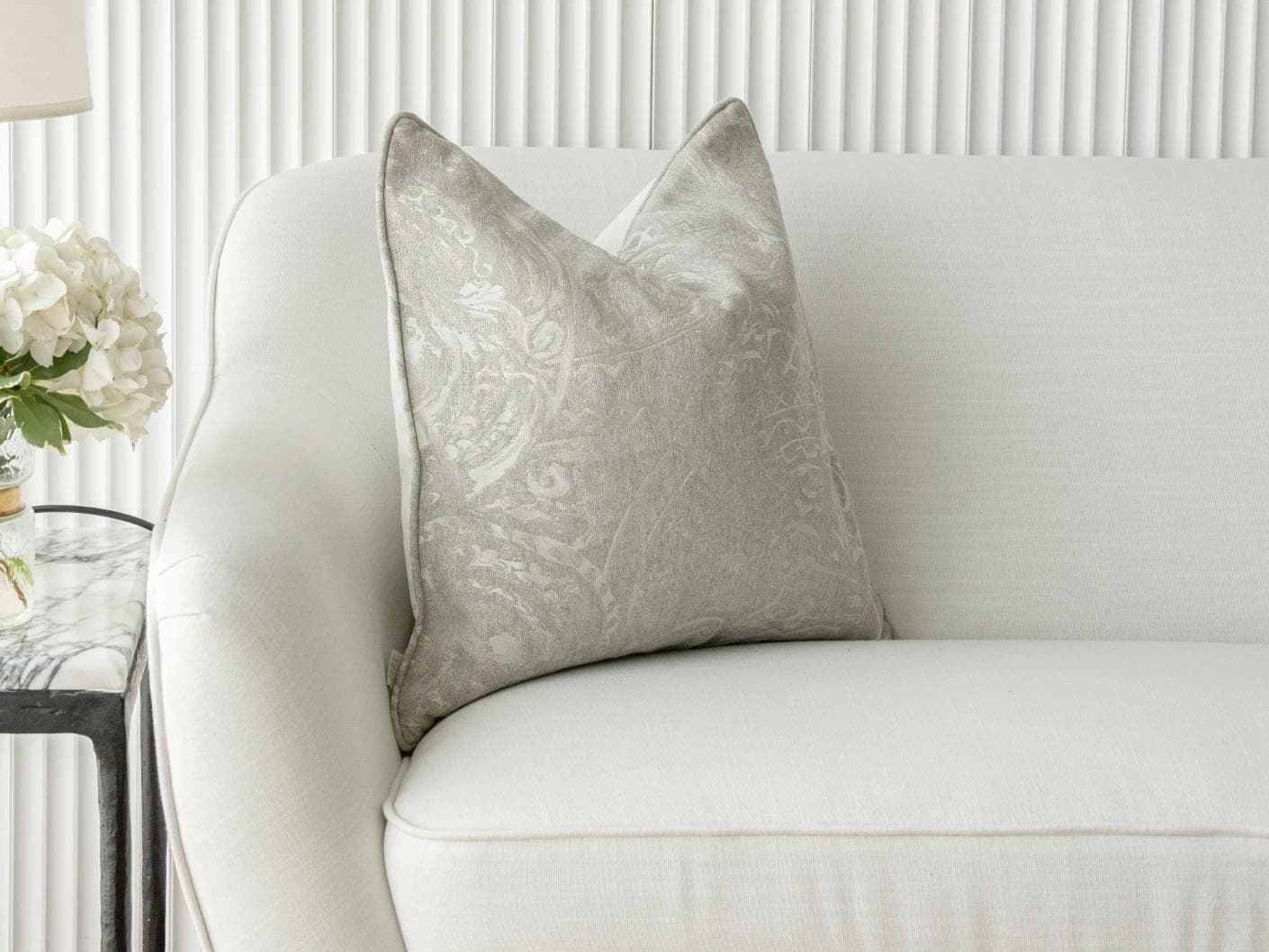 Berti Laurent cushion in silver, shown in a lifestyle front view as image 4