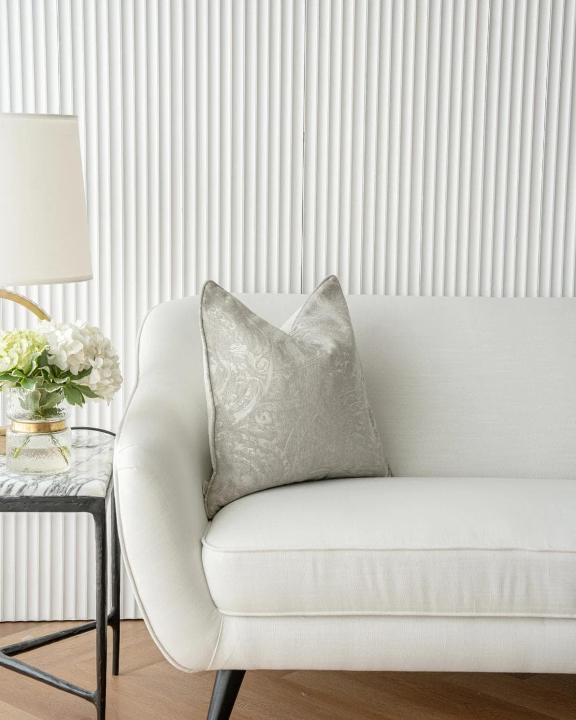 Berti Laurent cushion in silver, shown in a lifestyle front view as image 4