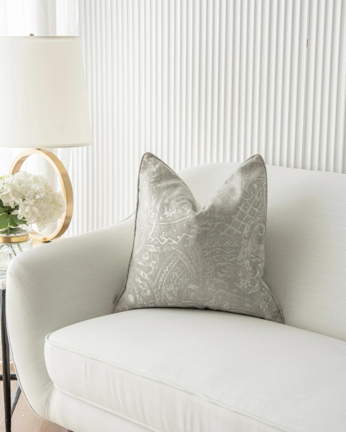 Berti Laurent cushion in silver, shown in a lifestyle front view as image 2