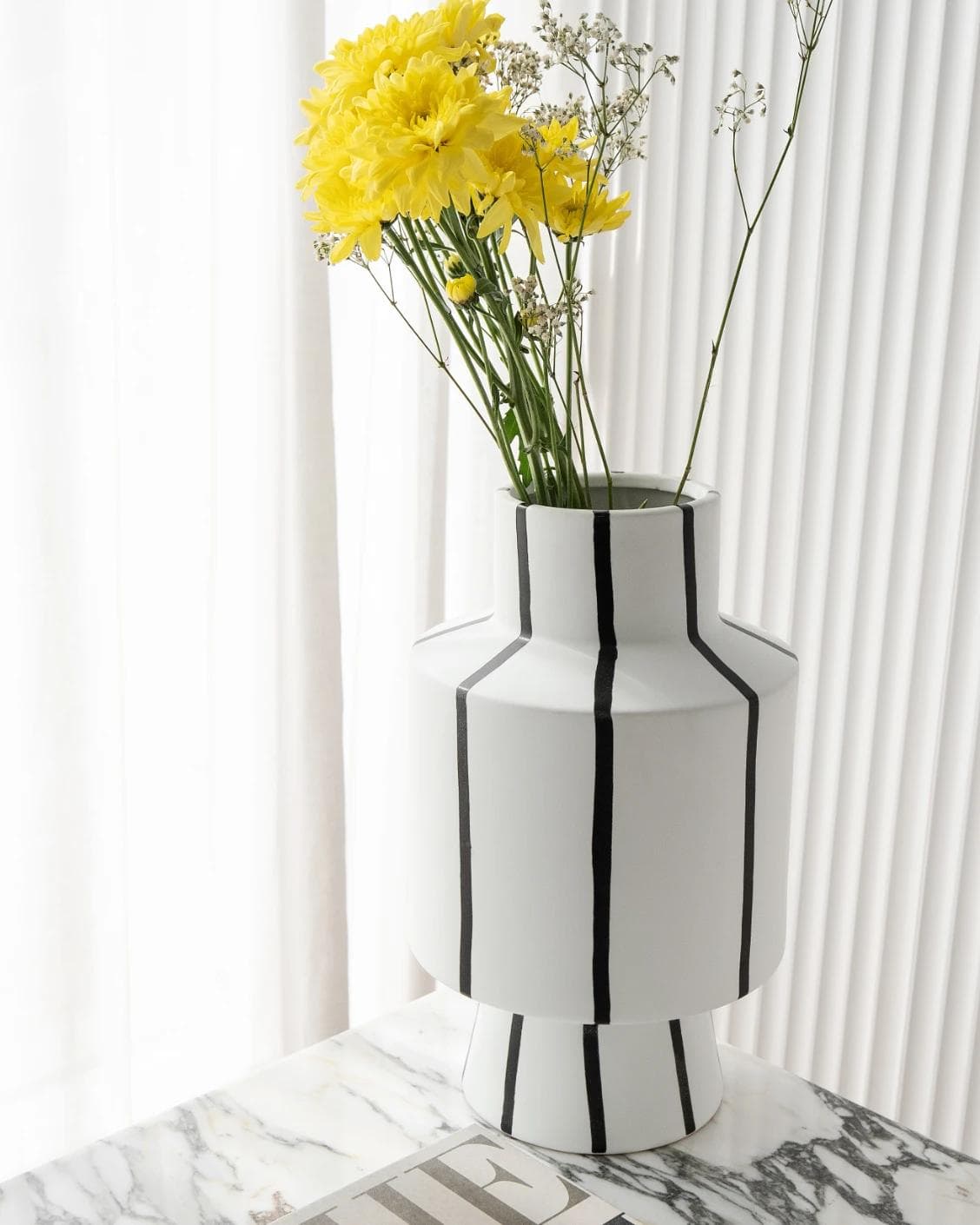 Bethany Arneson vases in white and black, shown in a lifestyle right view as image 4