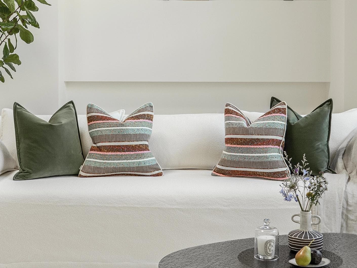 Blaire Bundle cushion in multicolour and green, shown in a lifestyle front view as image 4