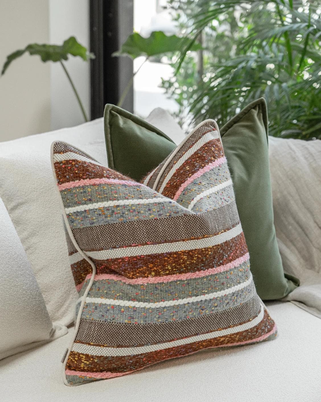 Blaire Bundle cushion in multicolour and green, shown in a lifestyle left view as image 5