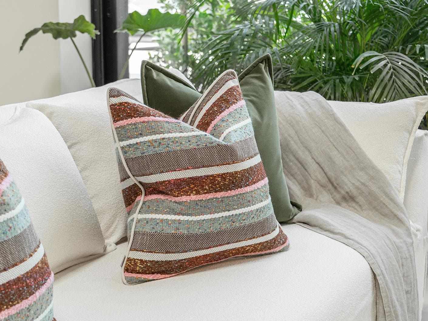 Blaire Bundle cushion in multicolour and green, shown in a lifestyle left view as image 6
