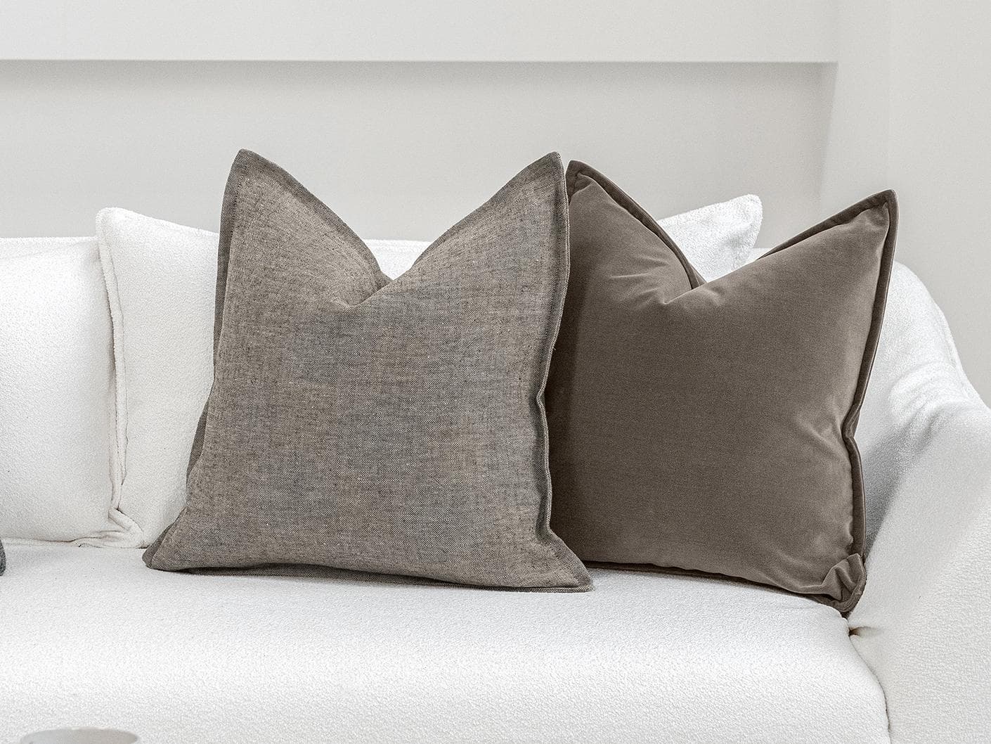 Bracia Bundle cushion in brown, grey and blue, shown in a lifestyle front view as image 5