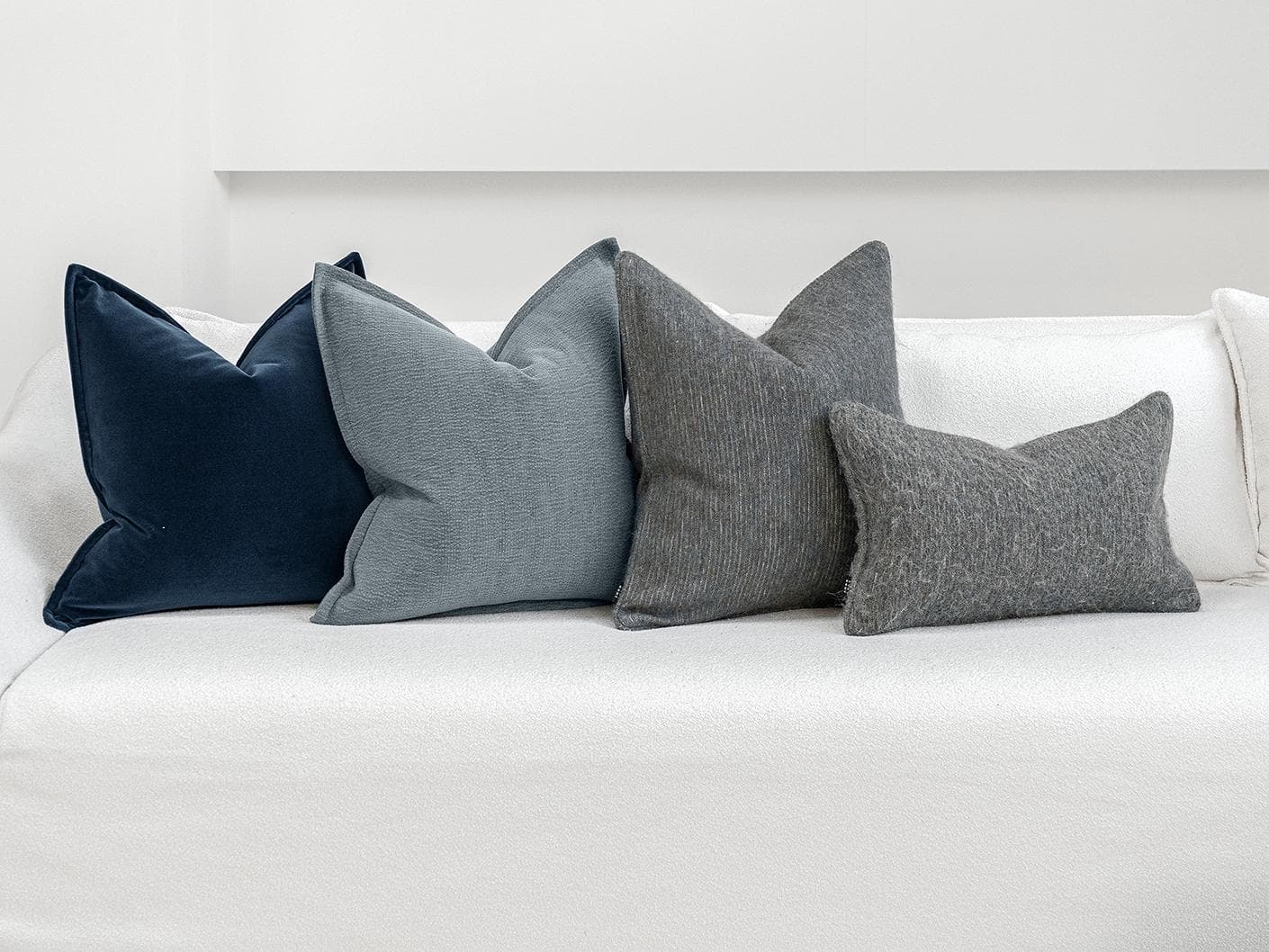 Bracia Bundle cushion in brown, grey and blue, shown in a product front view as image 6