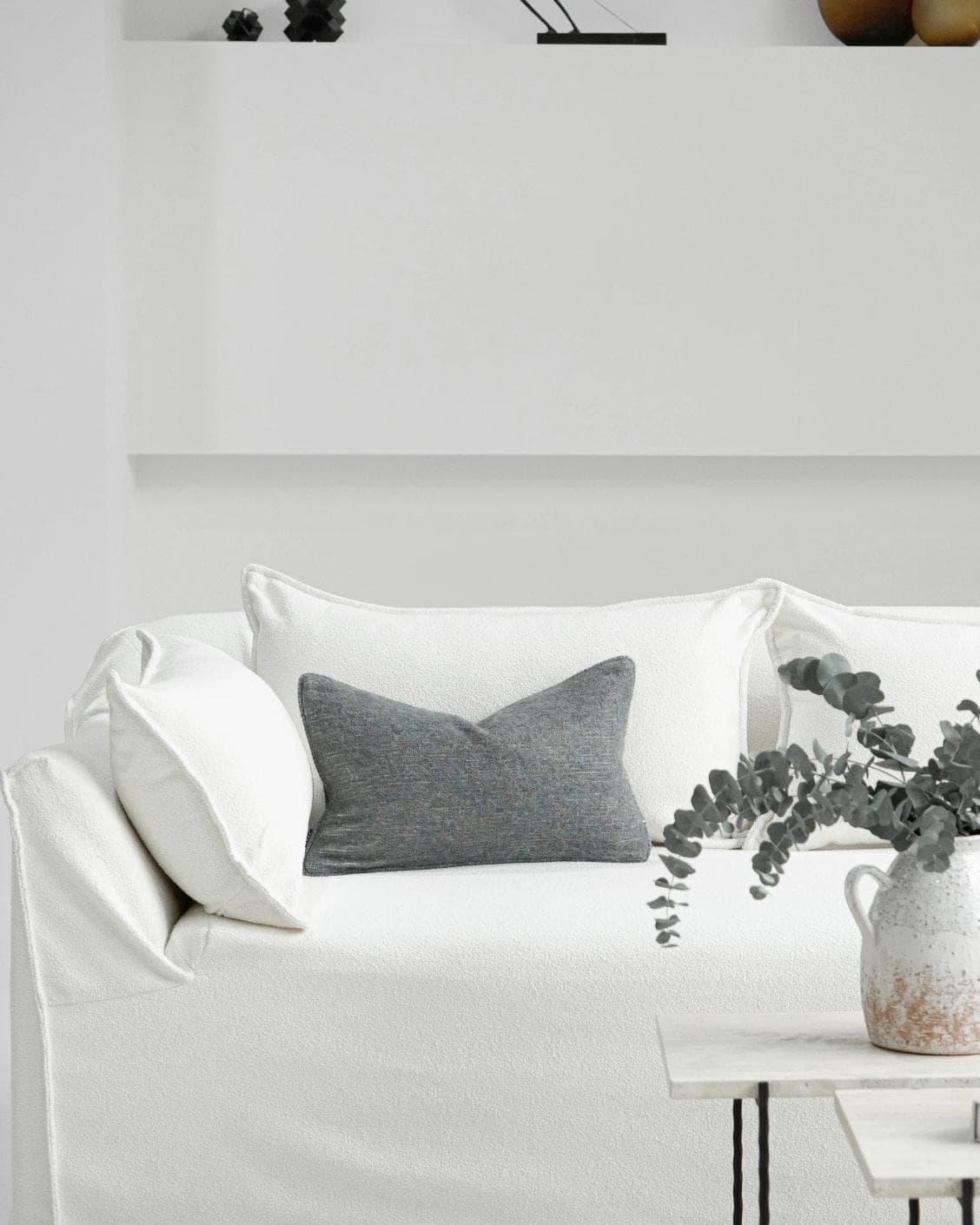 Bree Canova II cushion in grey and blue, shown in a lifestyle front view as image 4