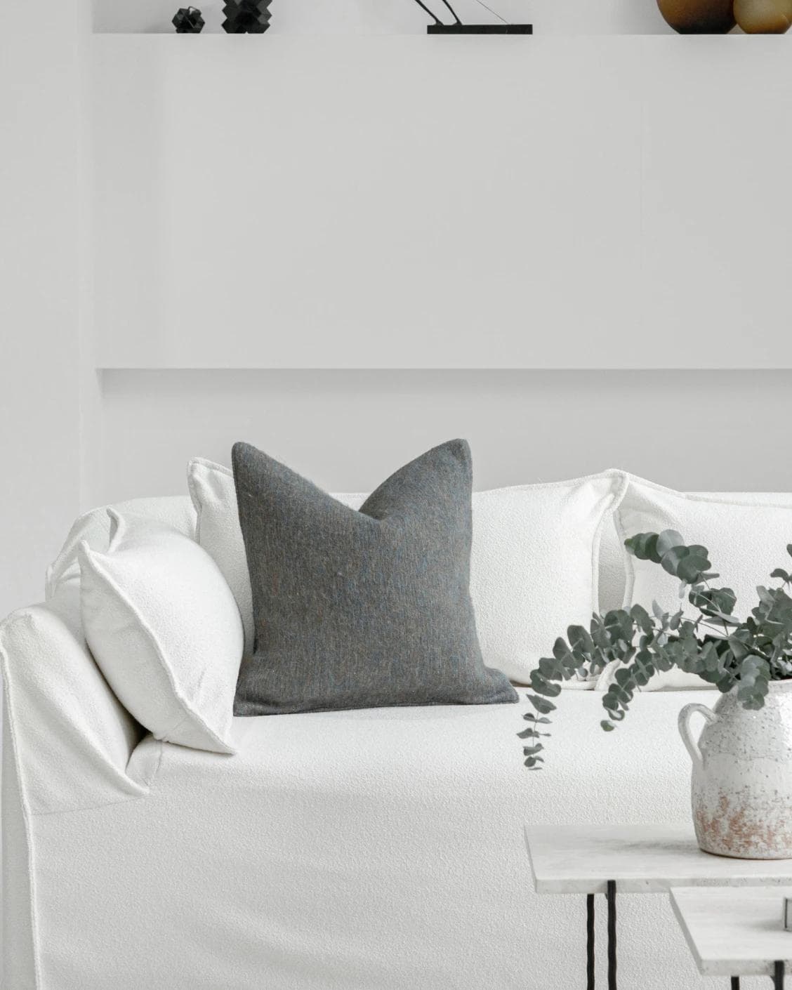 Bree Canova cushion in blue and grey, shown in a lifestyle front view as image 4