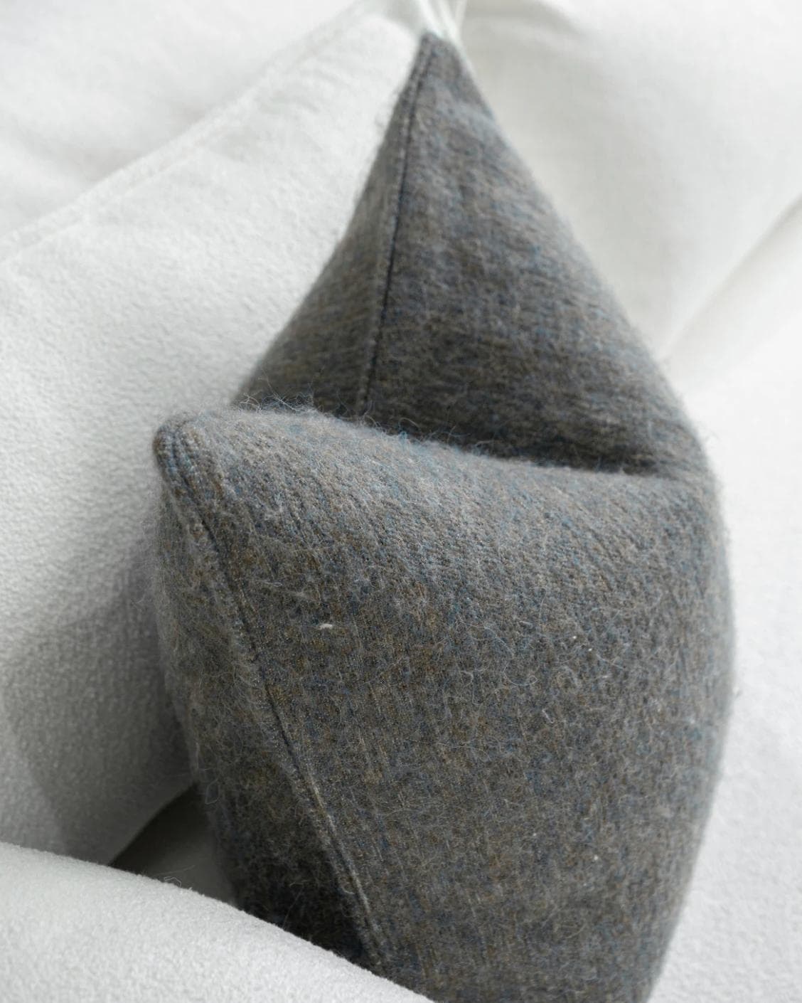 Bree Canova cushion in blue and grey, shown in a lifestyle top view as image 5