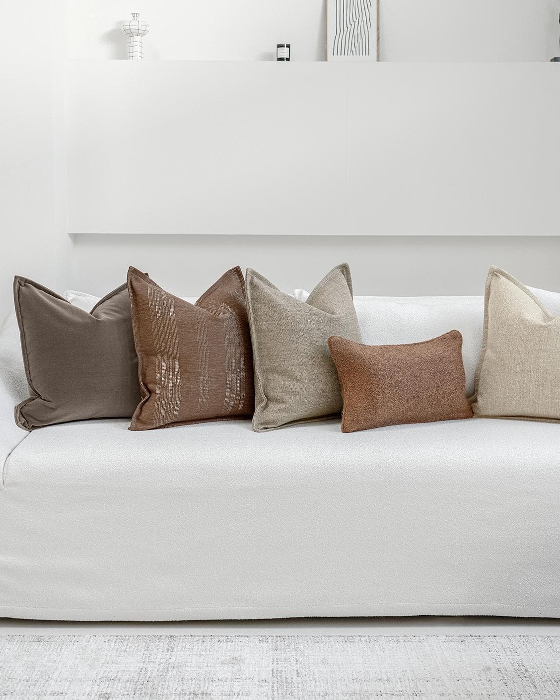 Bretty Bundle cushion in brown, charcoal, taupe and beige, shown in a lifestyle front view as image 6