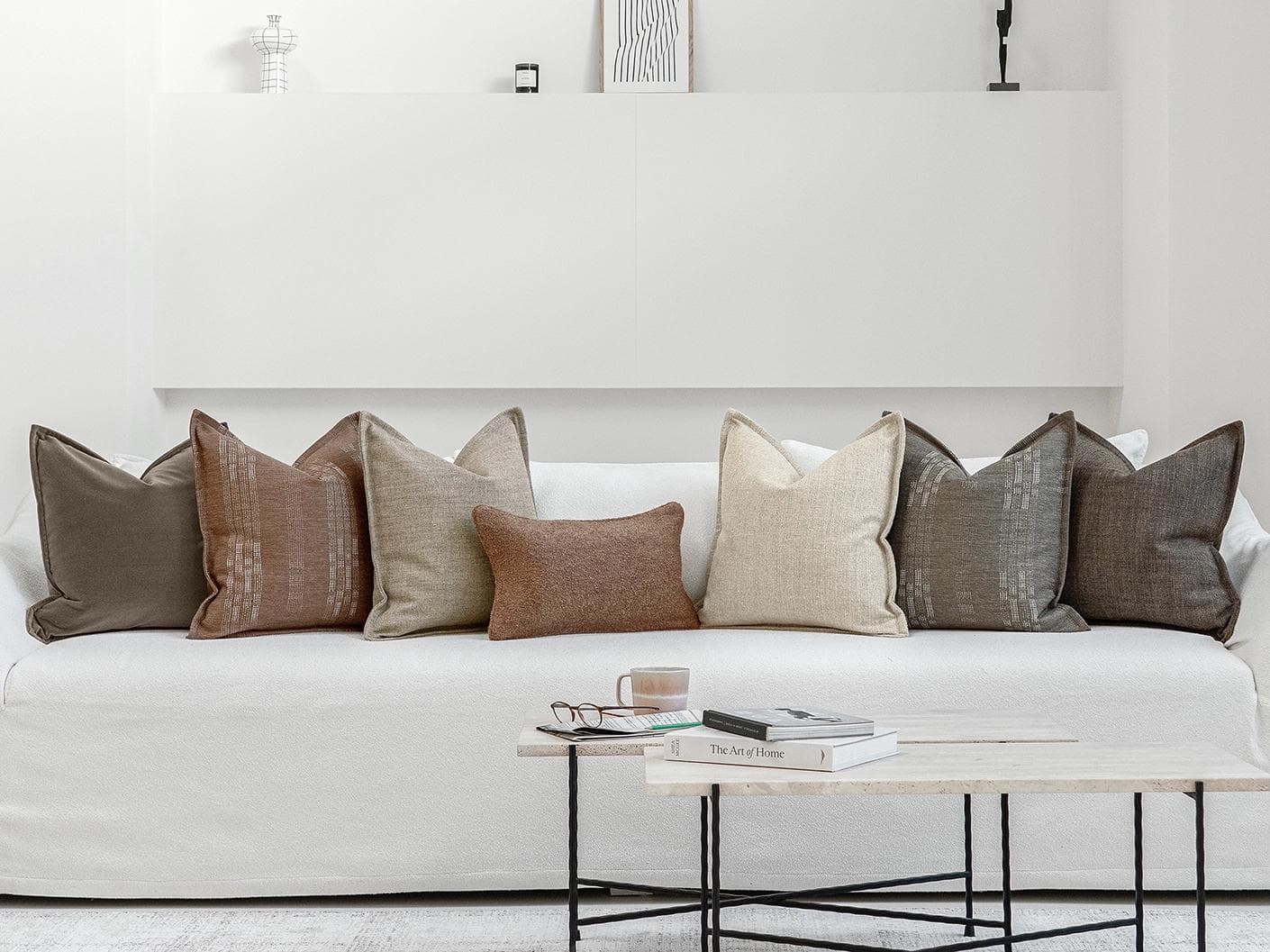 Bretty Bundle cushion in brown, charcoal, taupe and beige, shown in a lifestyle front view as image 4