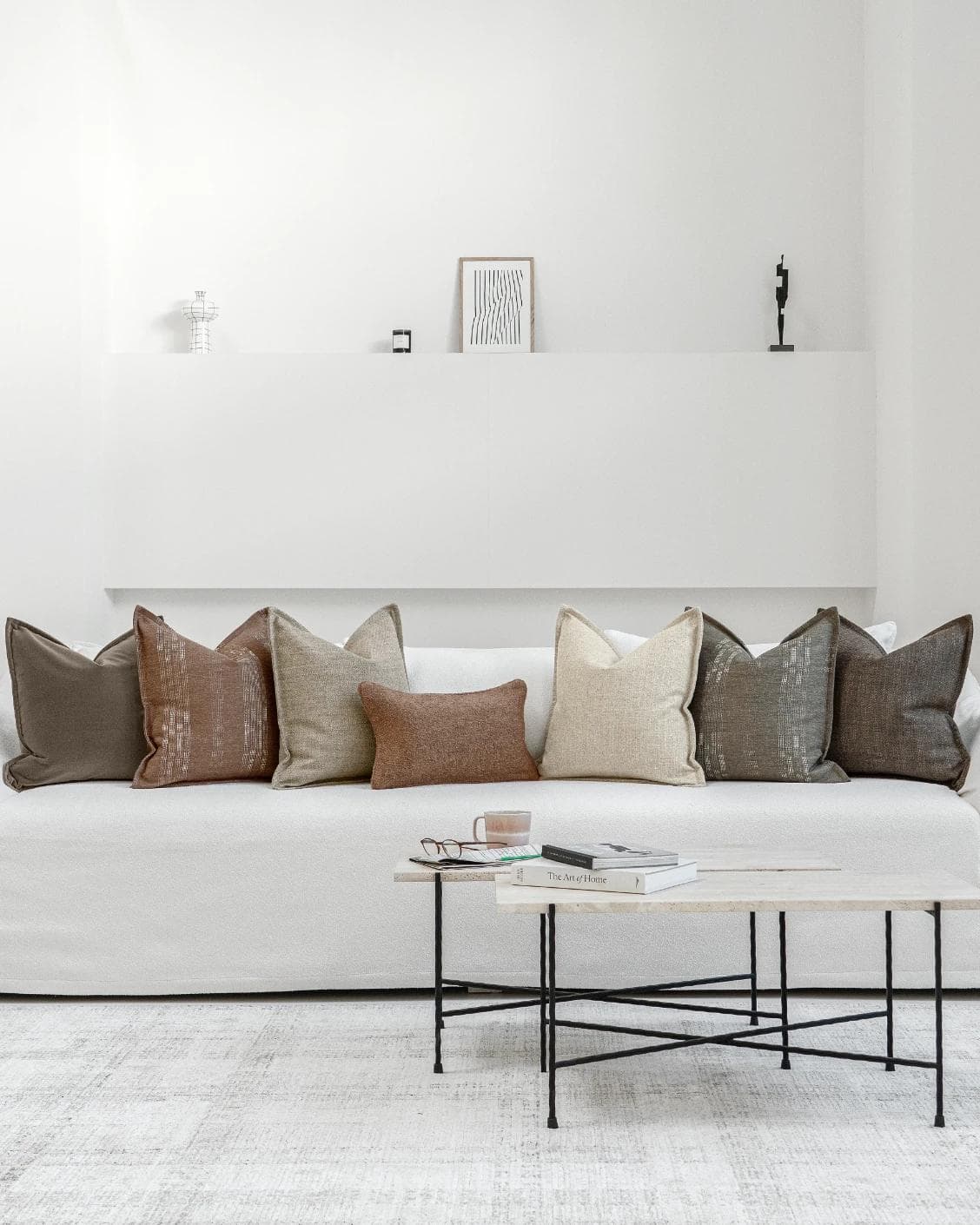 Bretty Bundle cushion in brown, charcoal, taupe and beige, shown in a lifestyle front view as image 4