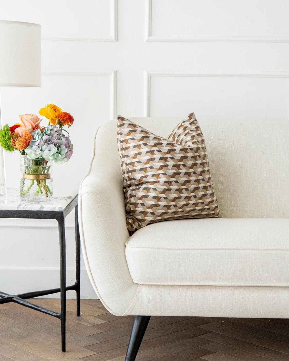Brianna Laurent cushion in orange and beige, shown in a lifestyle front view as image 4