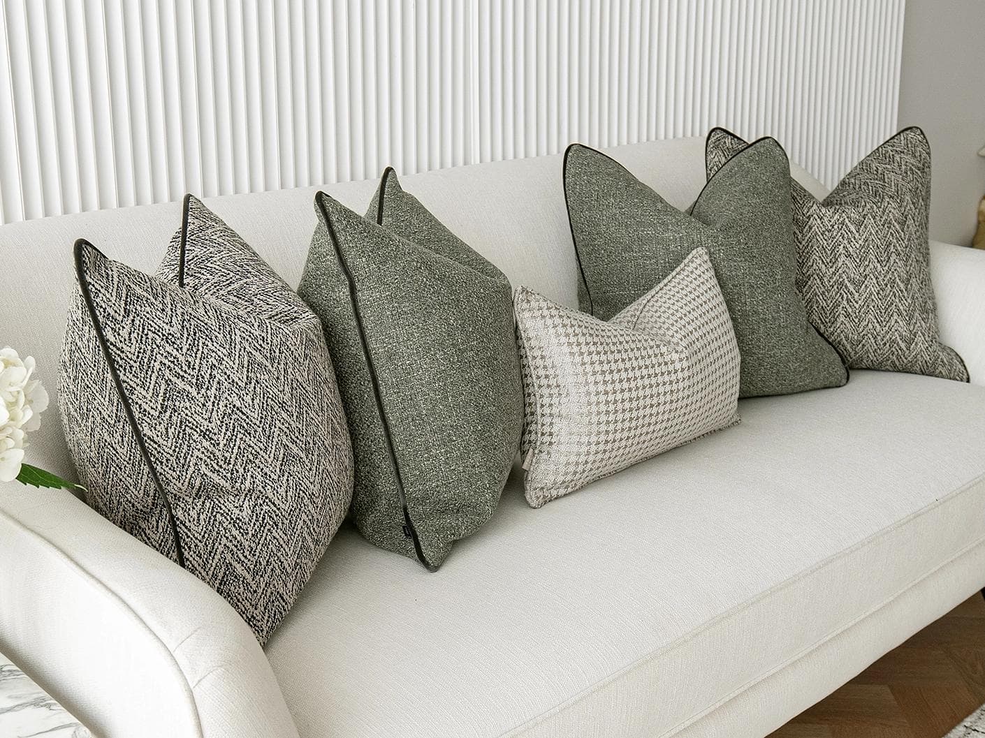 Constantine Bundle cushion in brown, shown in a lifestyle left view as image 4