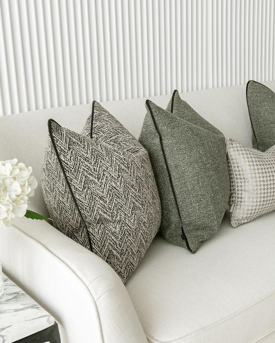 Constantine Bundle cushion in brown, shown in a lifestyle left view as image 4