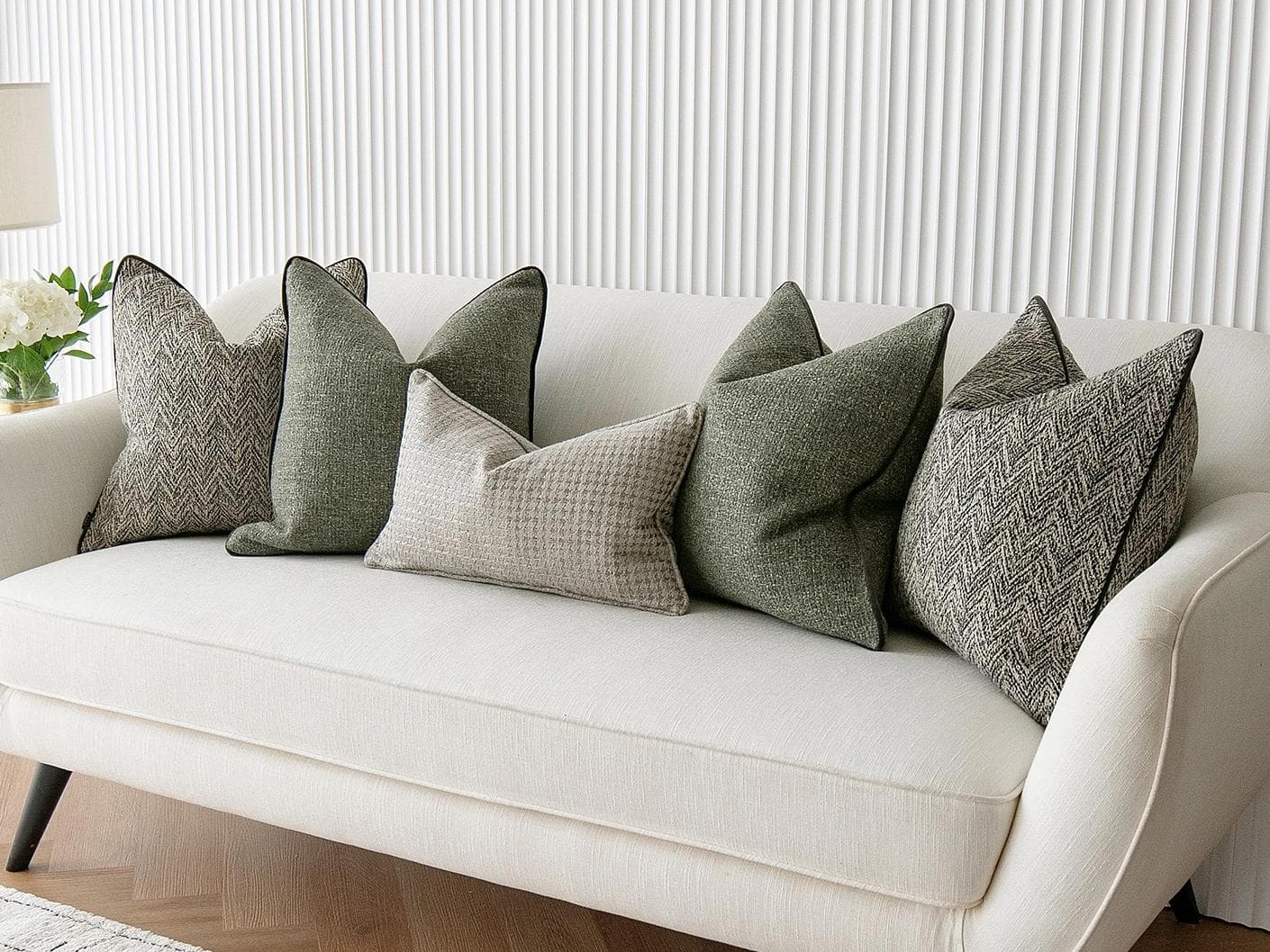 Constantine Bundle cushion in brown, shown in a lifestyle right view as image 5