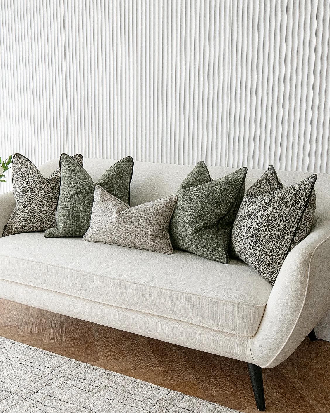 Constantine Bundle cushion in brown, shown in a lifestyle right view as image 5