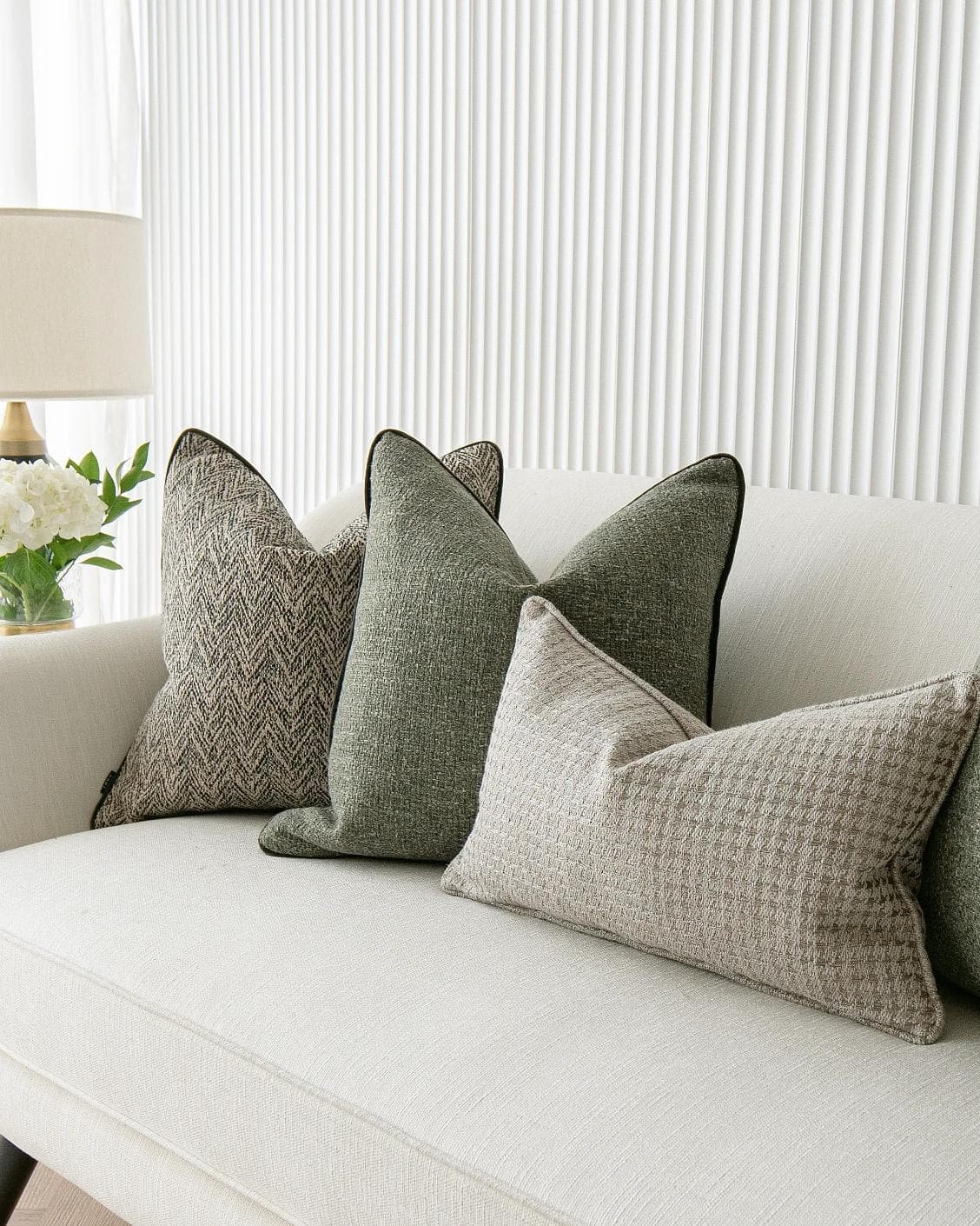 Constantine Bundle cushion in brown, shown in a lifestyle right view as image 6
