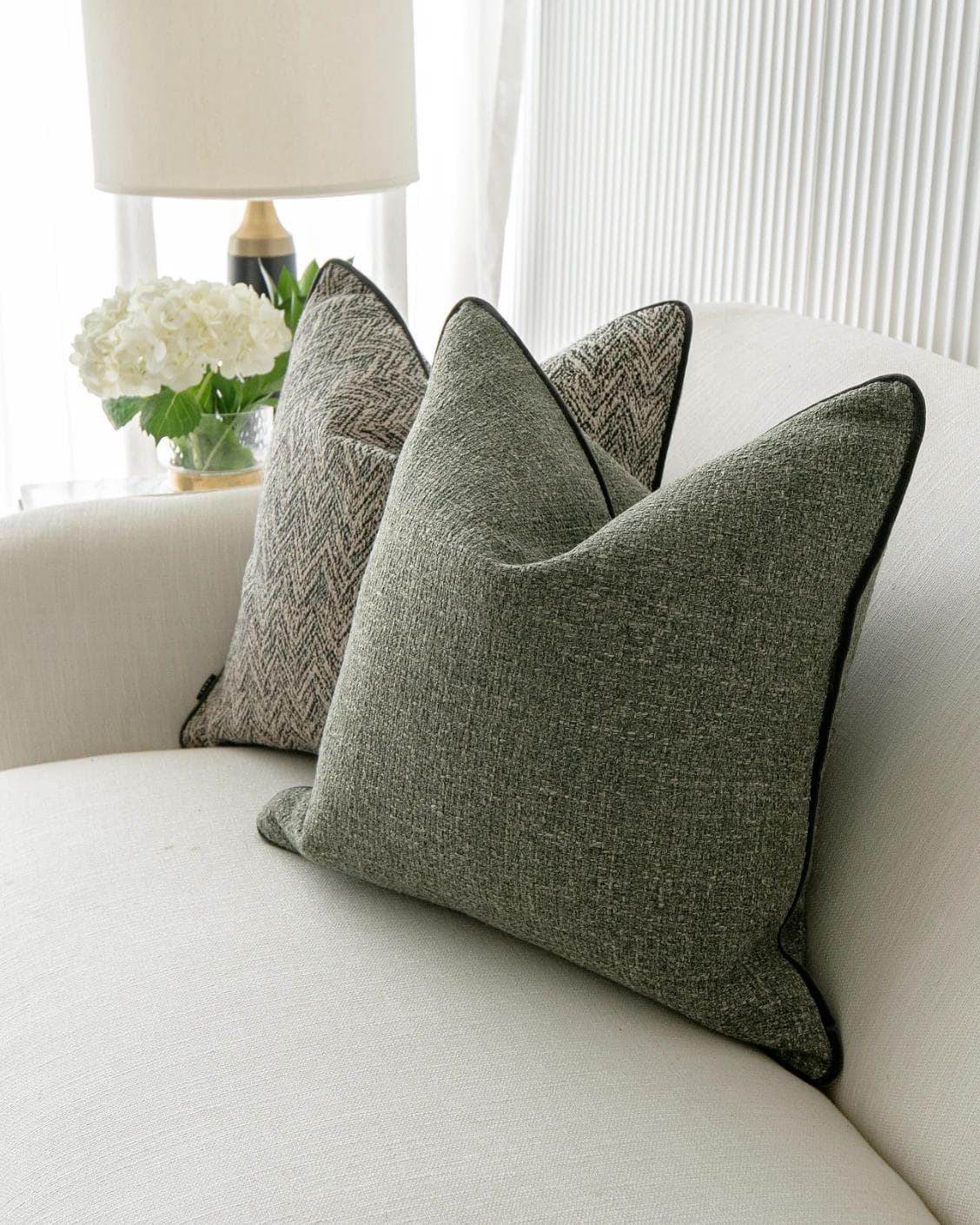Constantine Bundle cushion in brown, shown in a lifestyle right view as image 7