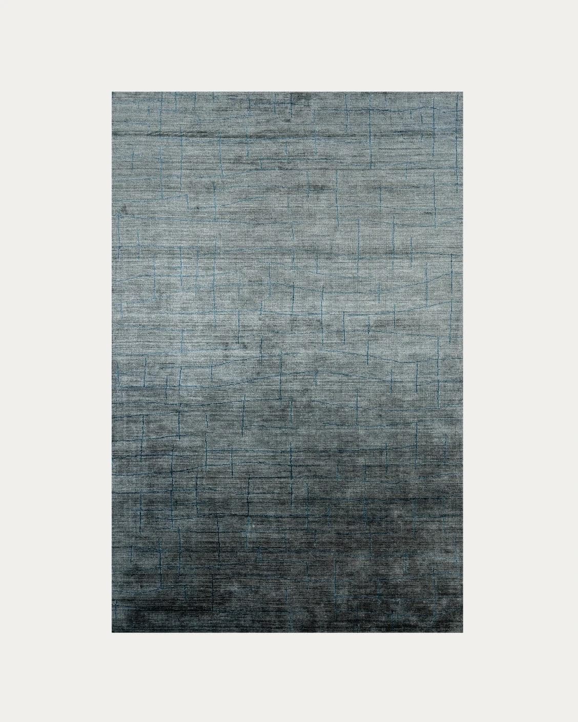 Caleb Ashton carpets in grey, teal and blue, shown in a product top view as image 1