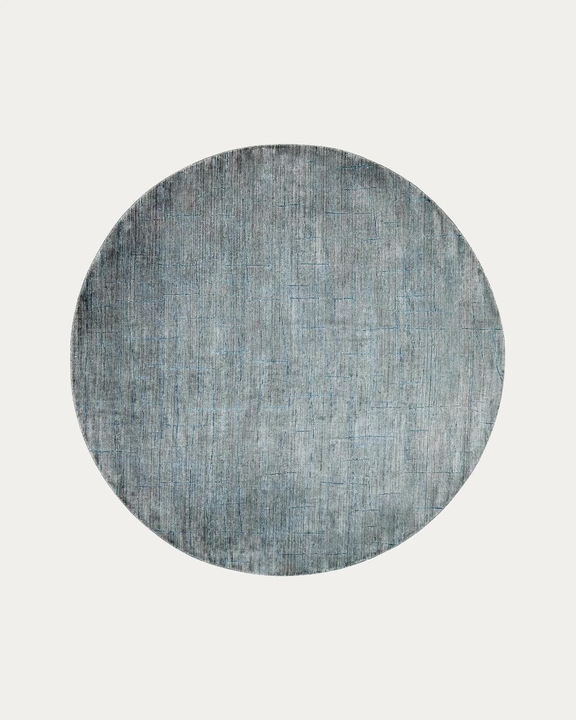 Caleb Ashton carpets in grey, teal and blue, shown in a product top view as image 1