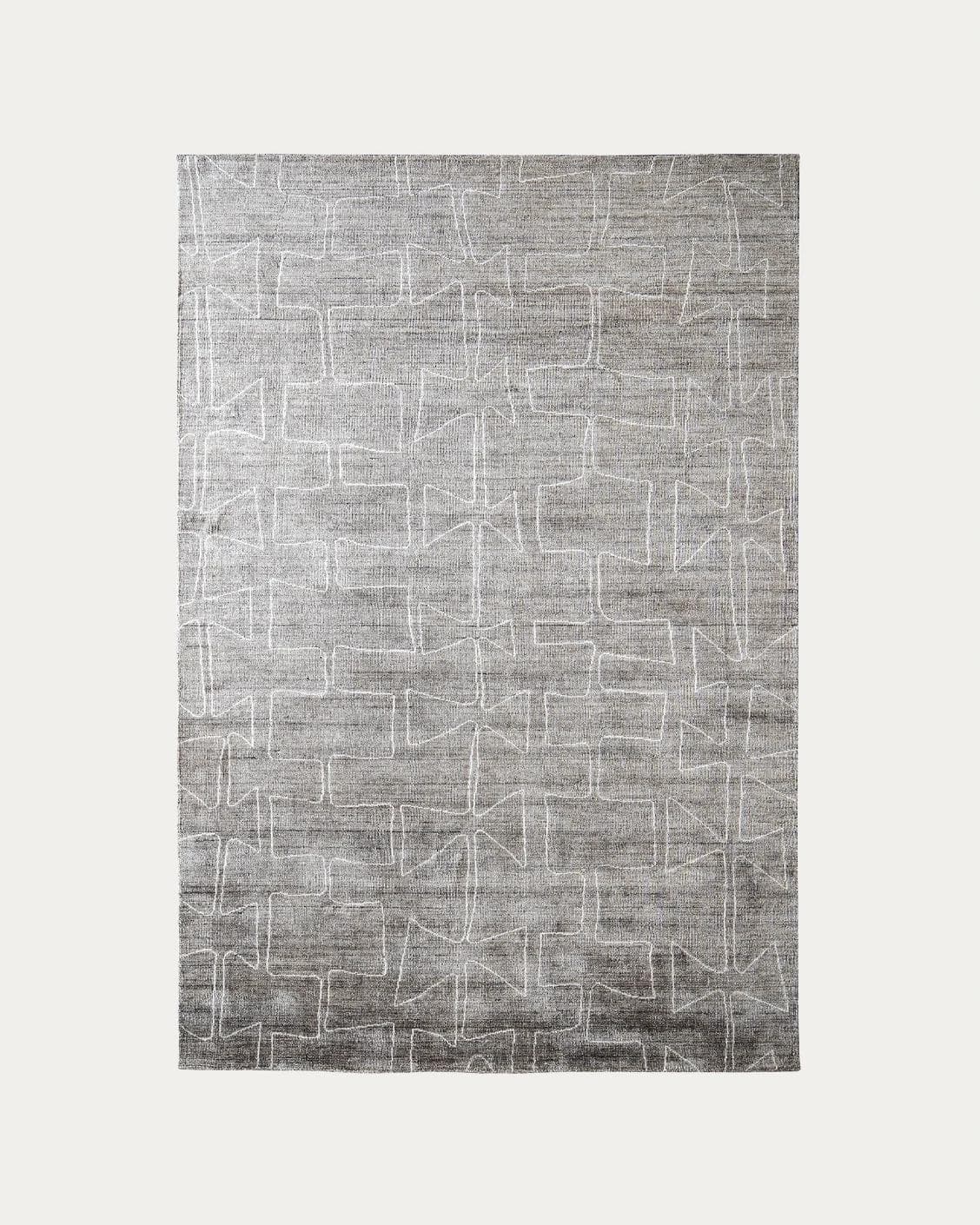 Caleb Dune carpets in grey and blue, shown in a product top view as image 1