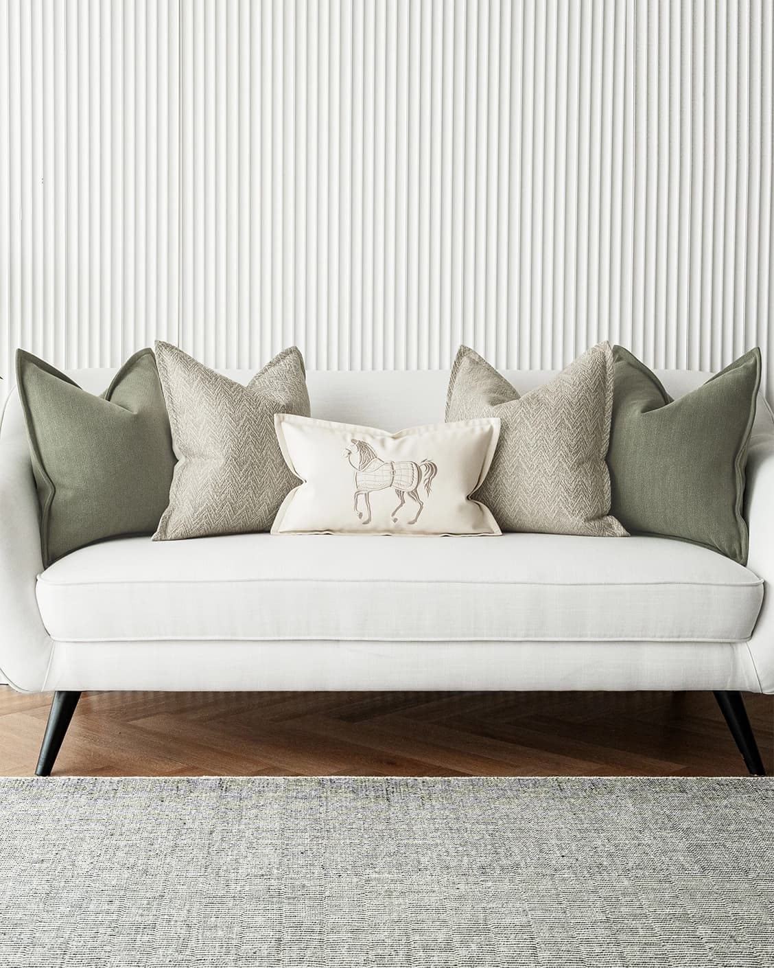 Cali Bundle cushion in white, beige and green, shown in a lifestyle front view as image 4