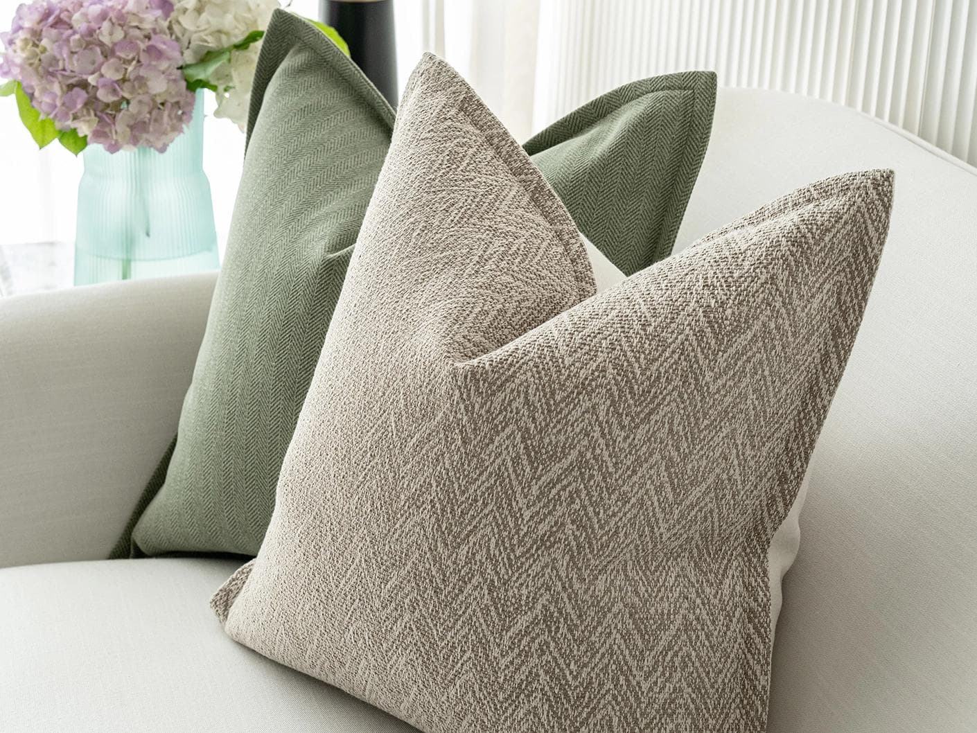 Cali Bundle cushion in white, beige and green, shown in a lifestyle right view as image 7