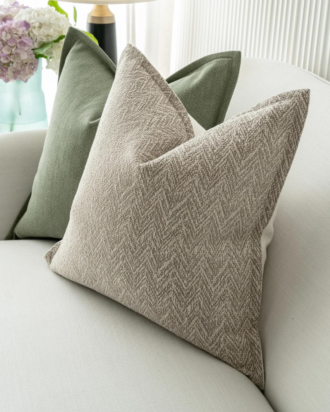 Cali Bundle cushion in white, beige and green, shown in a lifestyle right view as image 7