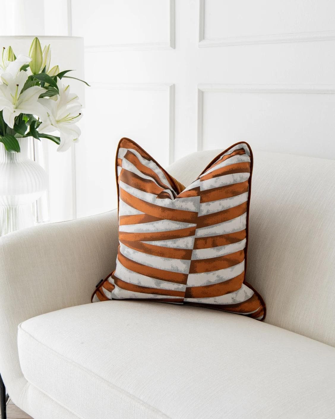 Carlie Hodler cushion in orange and white, shown in a product front view as image 2