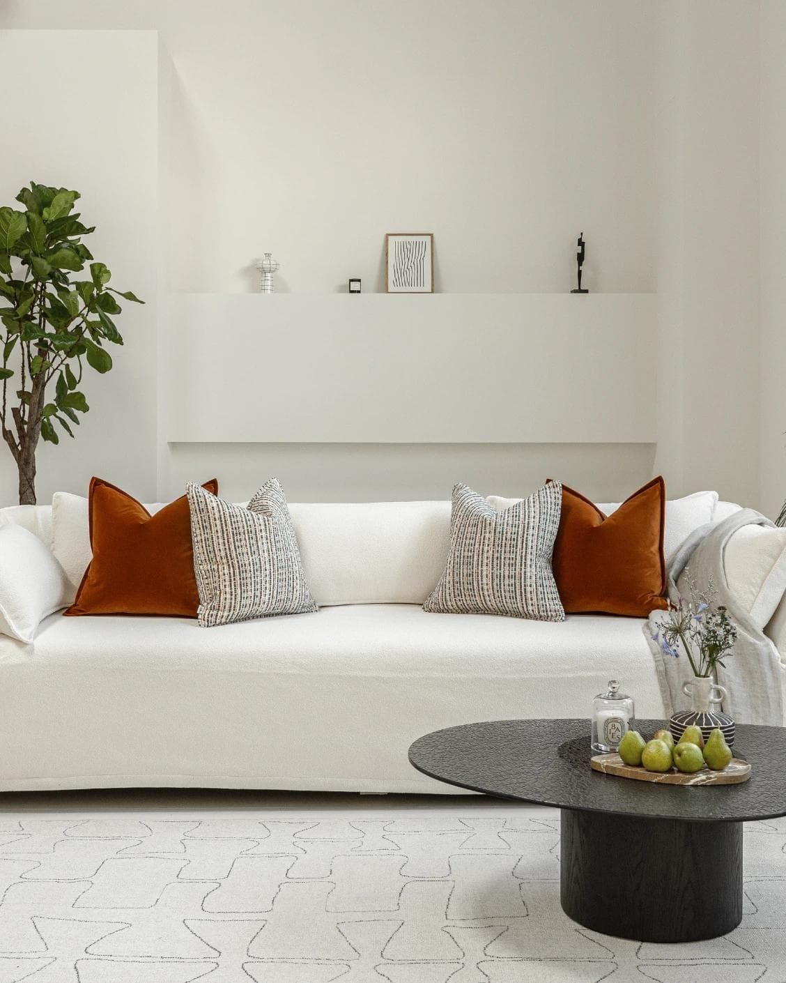 Cashwin Bundle cushion in cream and rust, shown in a lifestyle front view as image 4