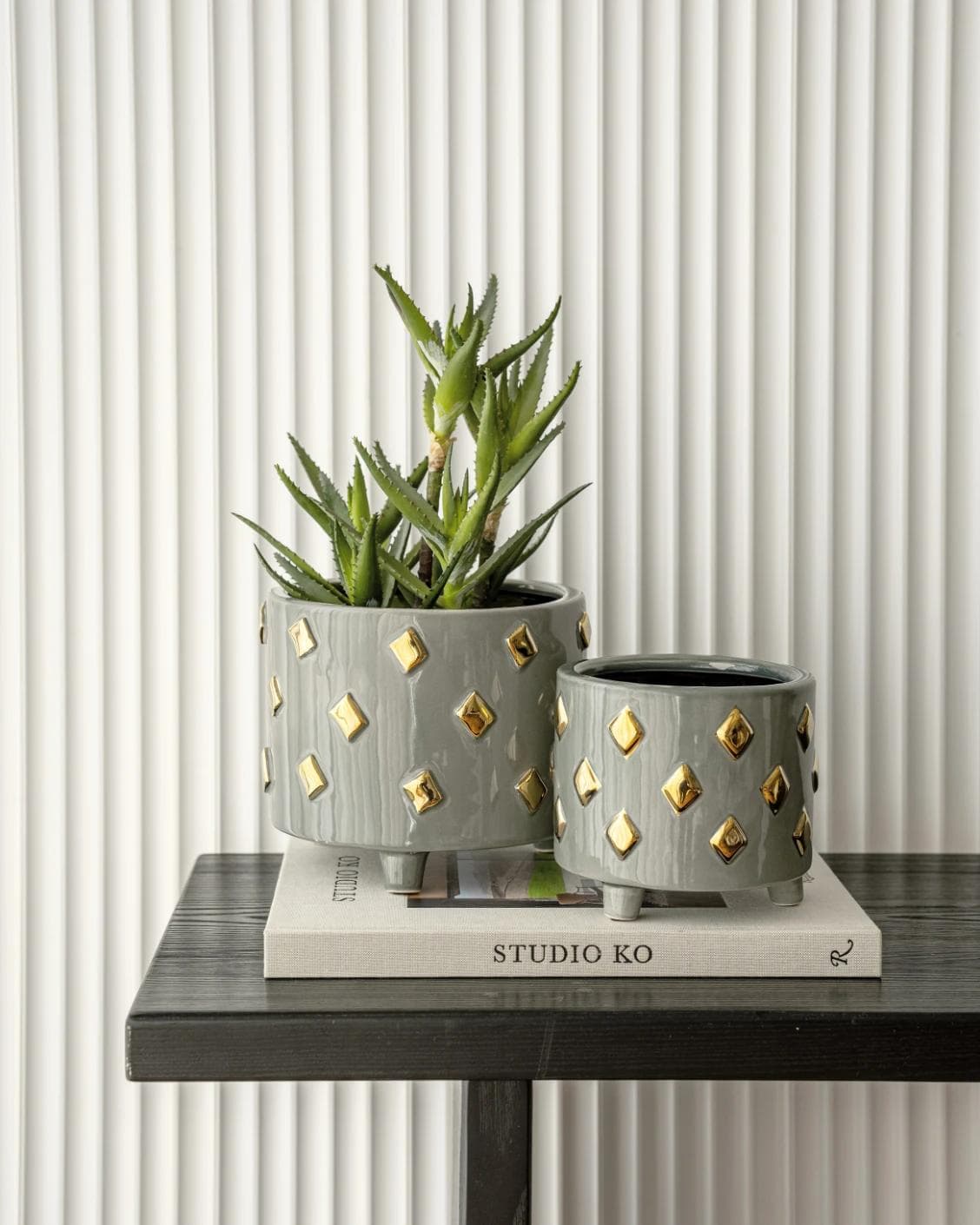 Caspian Arneson Bundle vases in grey and gold, shown in a lifestyle front view as image 5