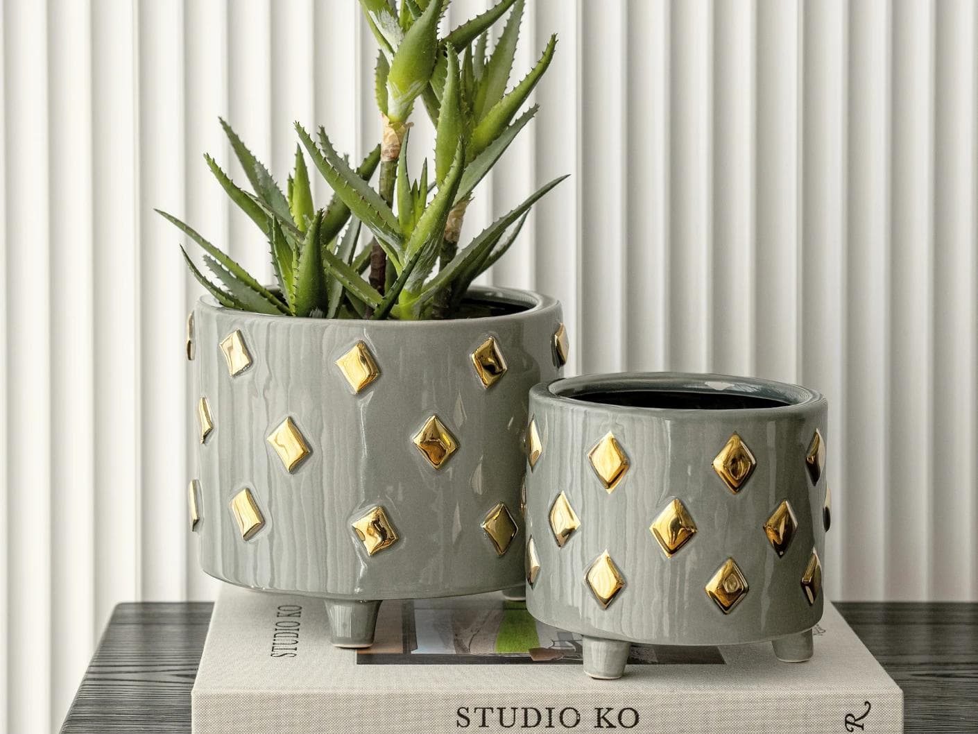 Caspian Arneson Bundle vases in grey and gold, shown in a lifestyle front view as image 5