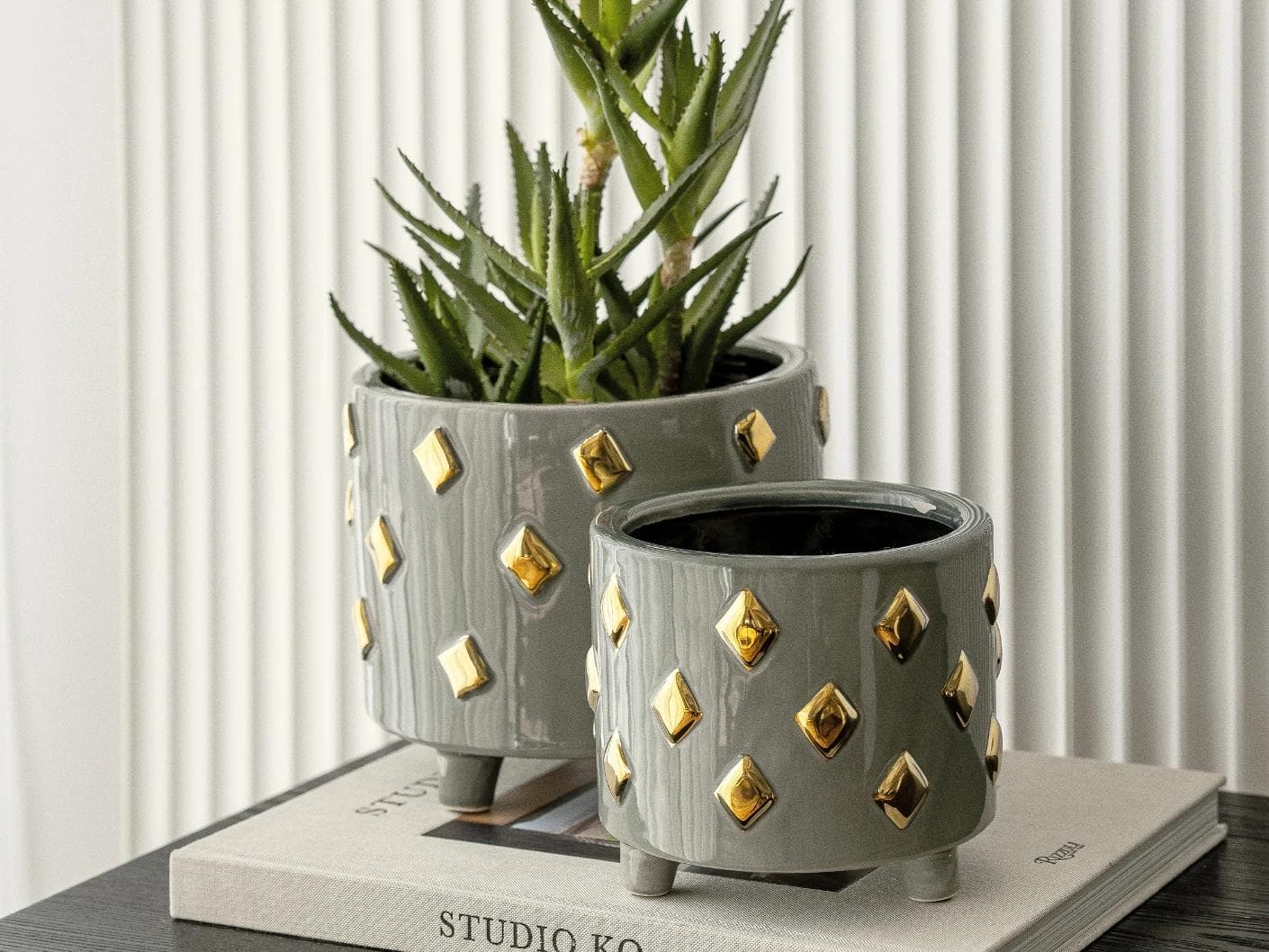Caspian Arneson Bundle vases in grey and gold, shown in a lifestyle right view as image 6