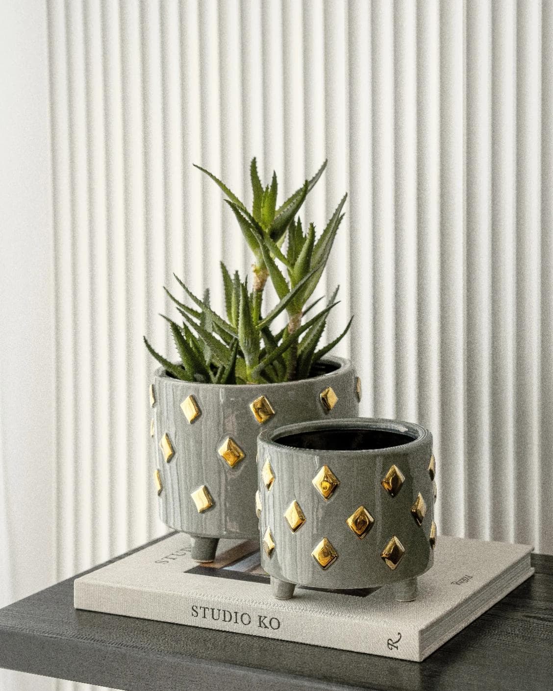 Caspian Arneson Bundle vases in grey and gold, shown in a lifestyle right view as image 6